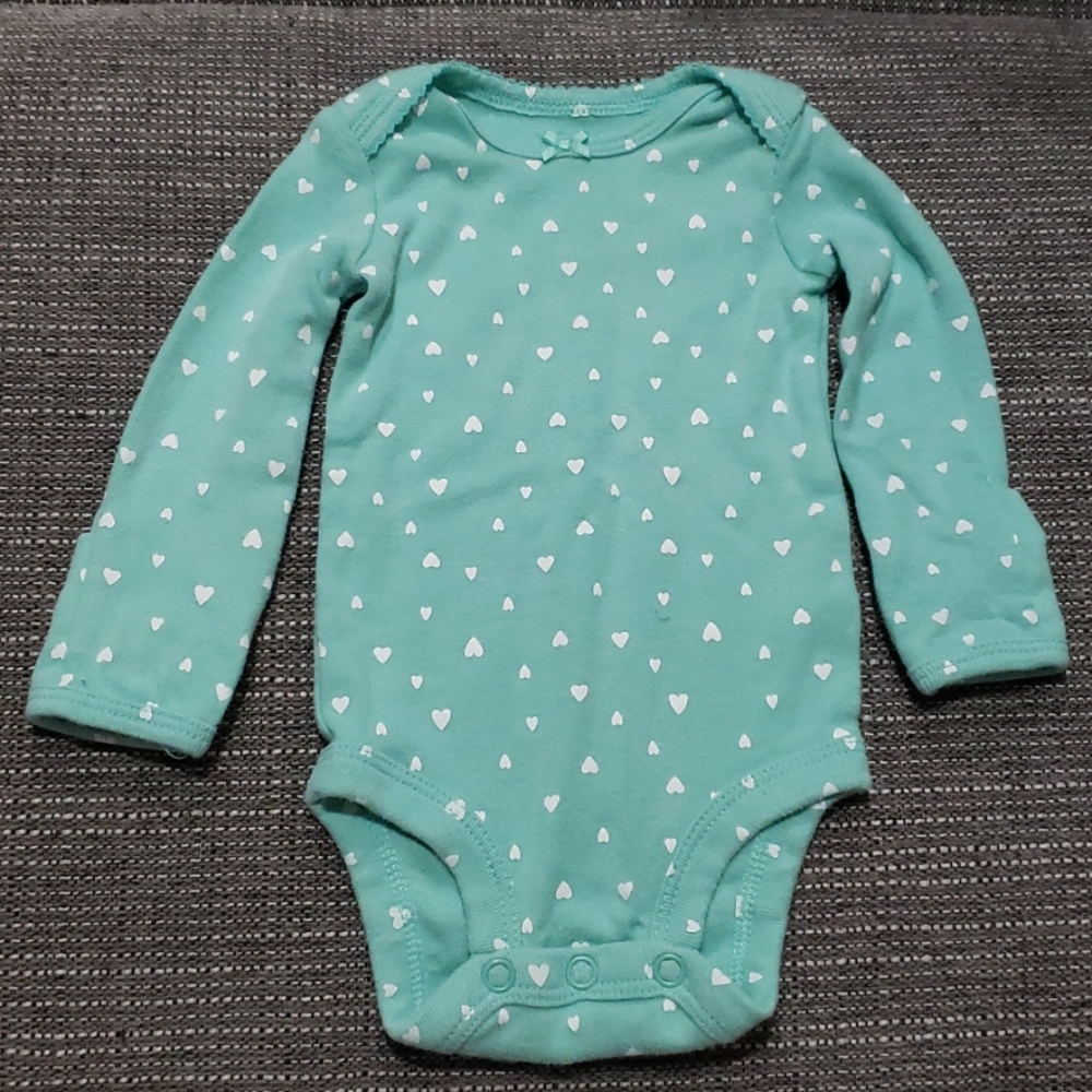 Newborn onesie with heart pattern